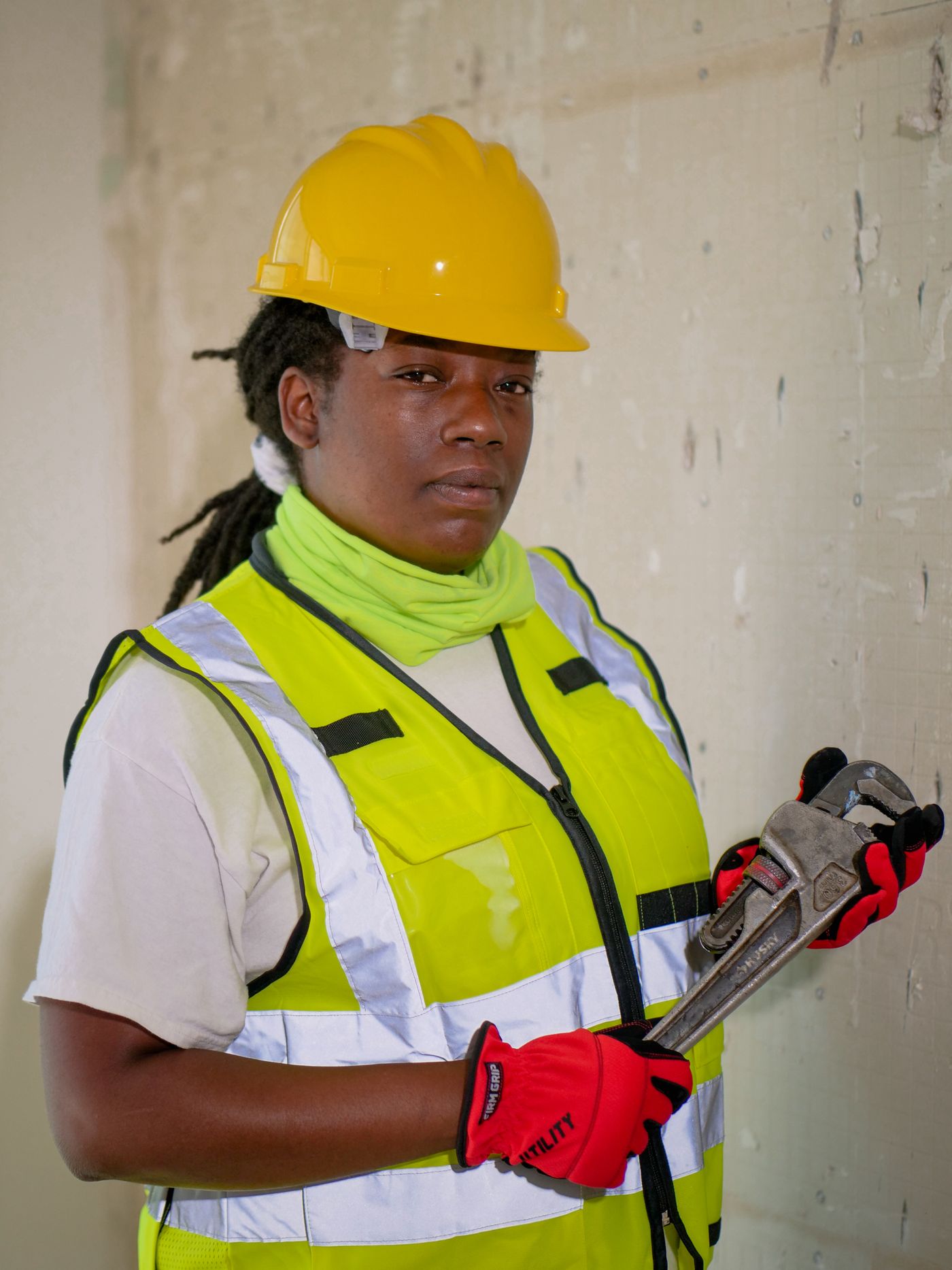 A plumber with a pipe wrench, ready for the job